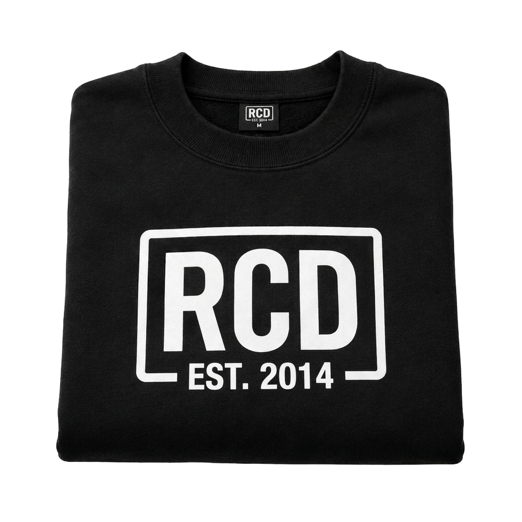 Folded black sweatshirt with a full-color RCD print